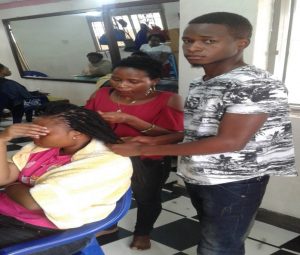  One of the UDPAS children who was supported and hence joined an apprenticeship training course in salon and hair dressing which he excellently accomplished and is now working